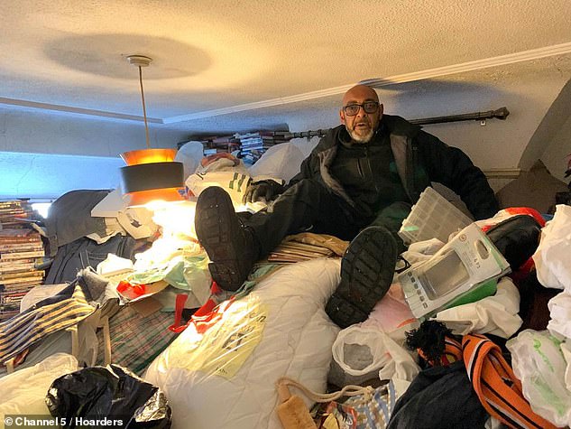 Hoard clearing expert George (pictured) was shocked to see the enormous piles of items Paul had collected. He had amassed so much the mounds were around six foot tall and almost reached the ceiling