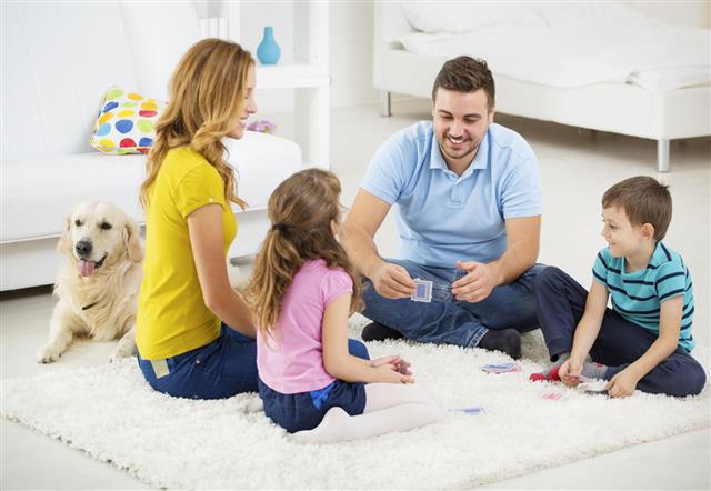 Cheerful Family Playing Cards